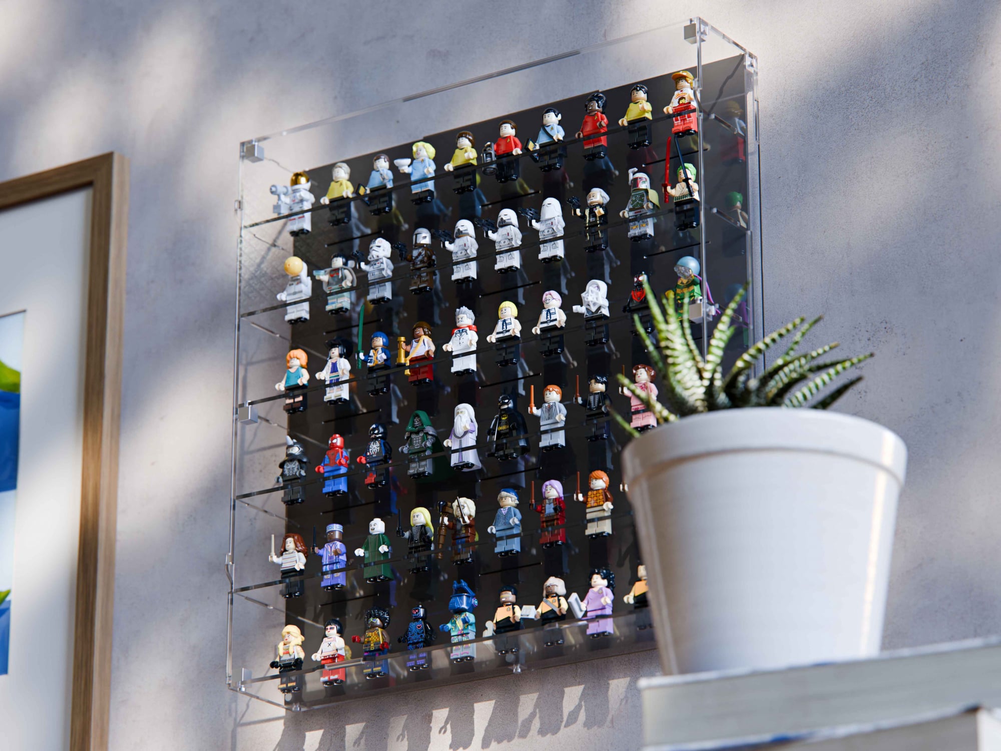 Wall mounted LEGO minifigure display case holding 60 minifigures on a wall